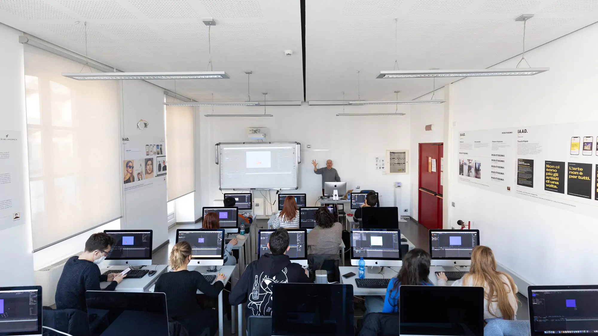IAAD University classroom for Master in Digital Marketing with students seated at desks with computers